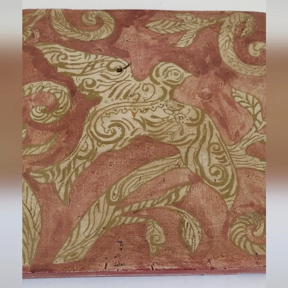 Kate McRostie hand-painted tile wall hanging with bird in bole